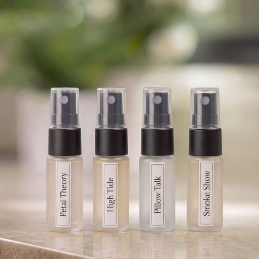 Four discovery bottles of Animique pet-safe linen and room spray on a marble countertop