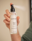 High Tide room and linen spray by Animique — pet-safe home fragrance being sprayed by a man's hand